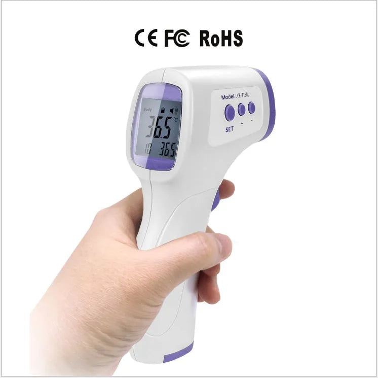White RAK-FI03 infrared forehead thermometer held near a child's forehead showing non-contact measurement