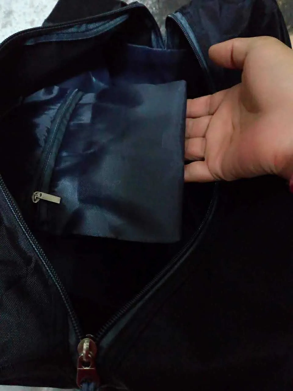 Nylon gym and yoga bag shown in black, available in medium and large sizes.