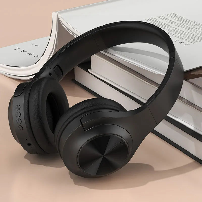 Wireless Bluetooth headset in ivory white, chalk black, or youth green colour, showing head-mounted design.
