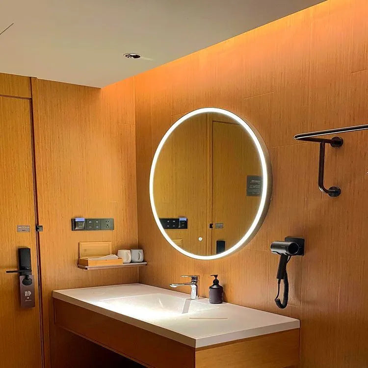 Round black aluminium frame LED bathroom mirror mounted on wall with touch control.