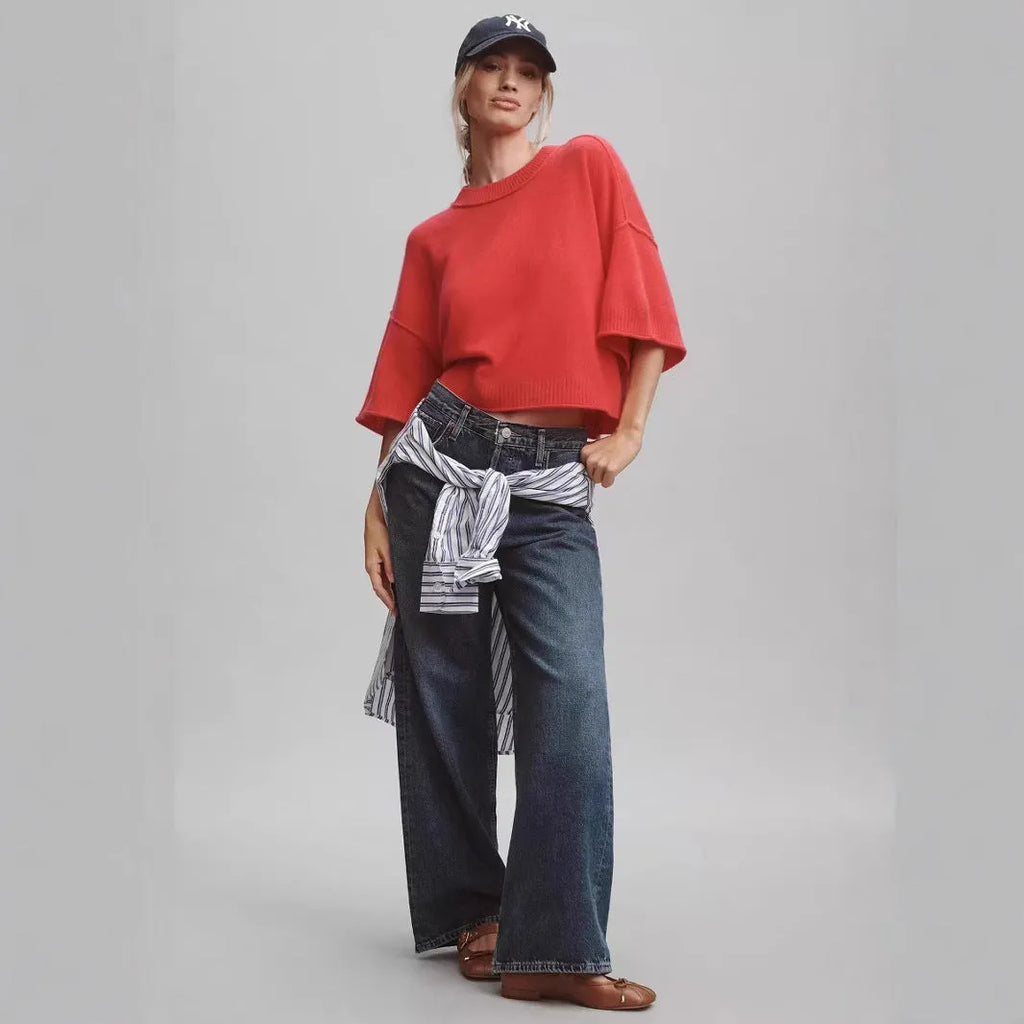 Red hot girl style viscose t-shirt with short sleeves and an exposed navel cut on a mannequin.
