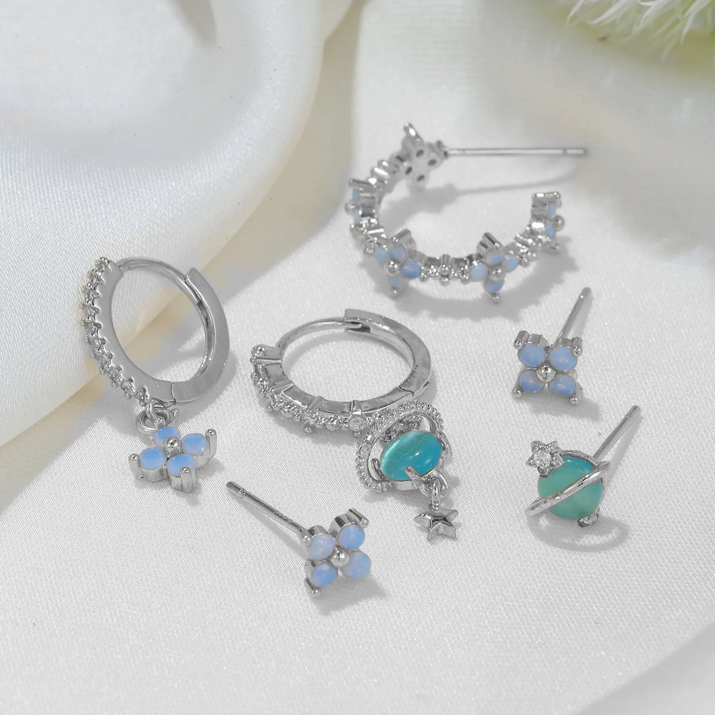Flower shaped ear studs with blue zircon mosaic in gold and silver colour options