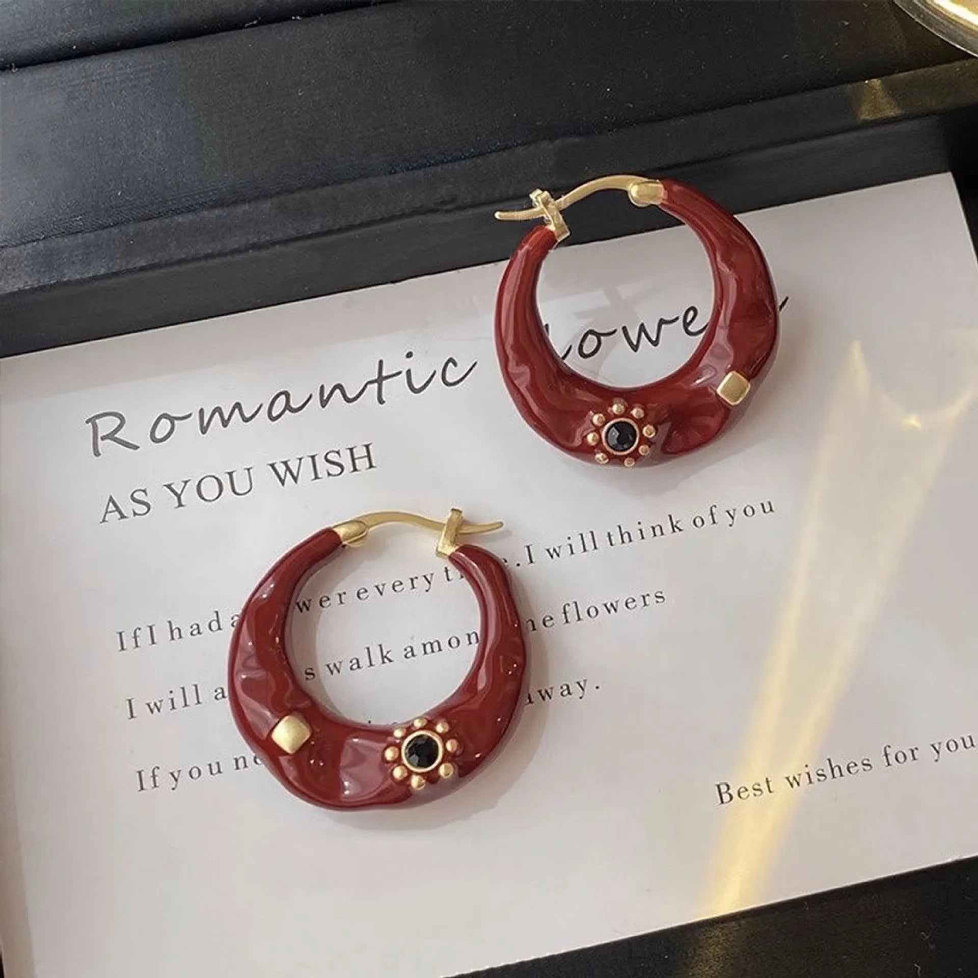 A pair of retro Hong Kong style alloy ear studs with rhinestone inlay, shown in black and red colour options.