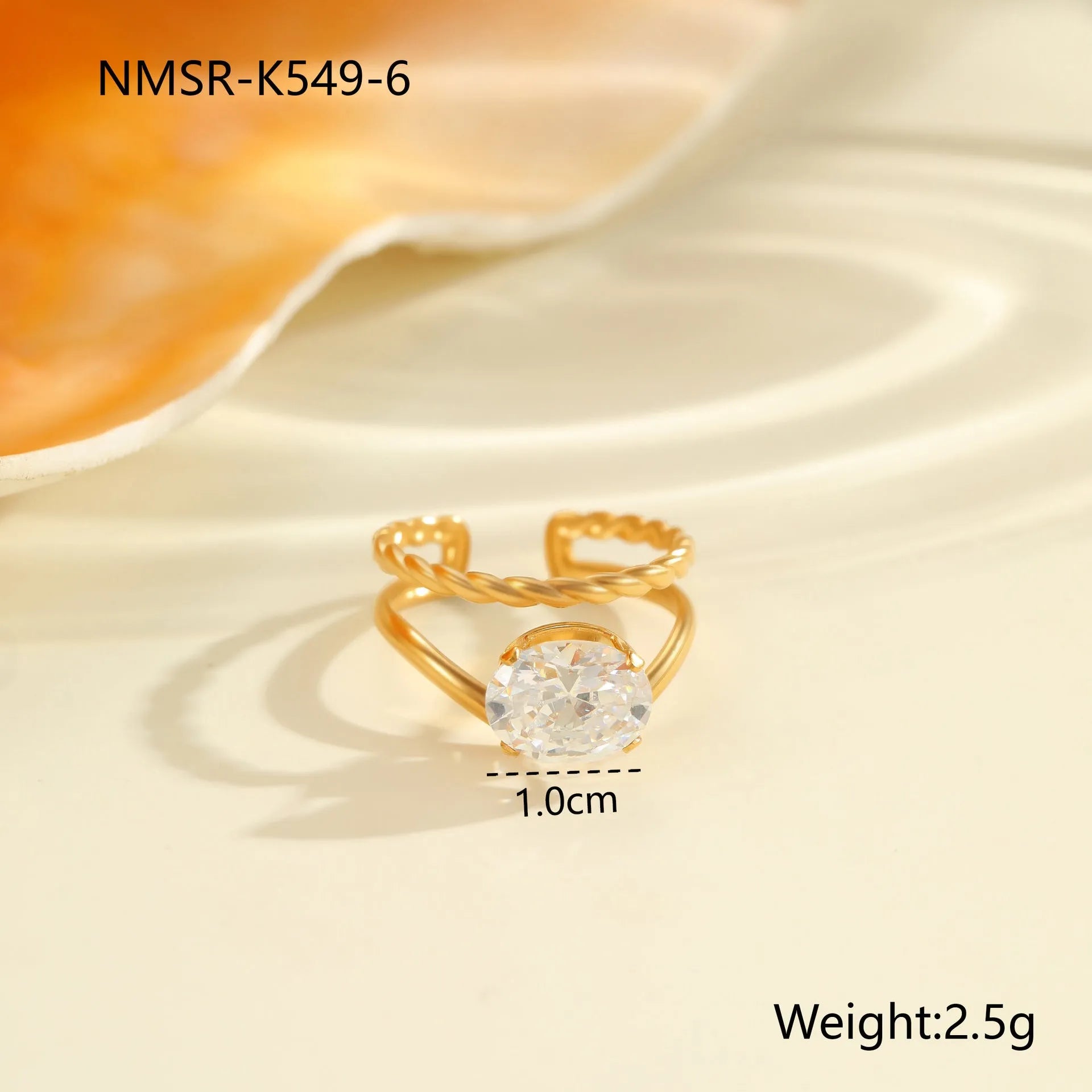 Stainless steel women's ring with gold electroplating and zircon details in geometry design
