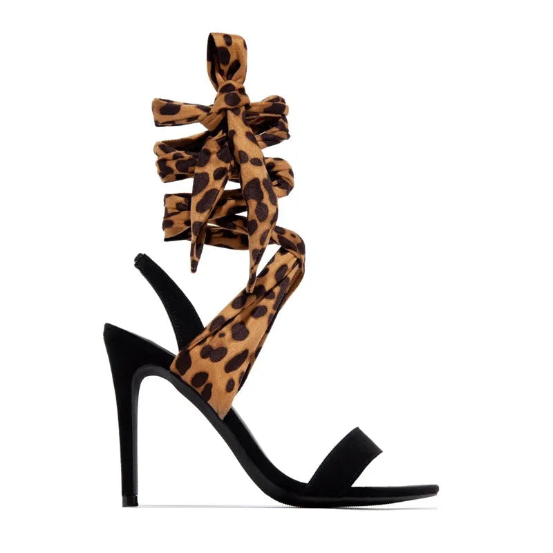 Light brown leopard print high heel sandals with Roman-style cross straps and 8cm+ heel