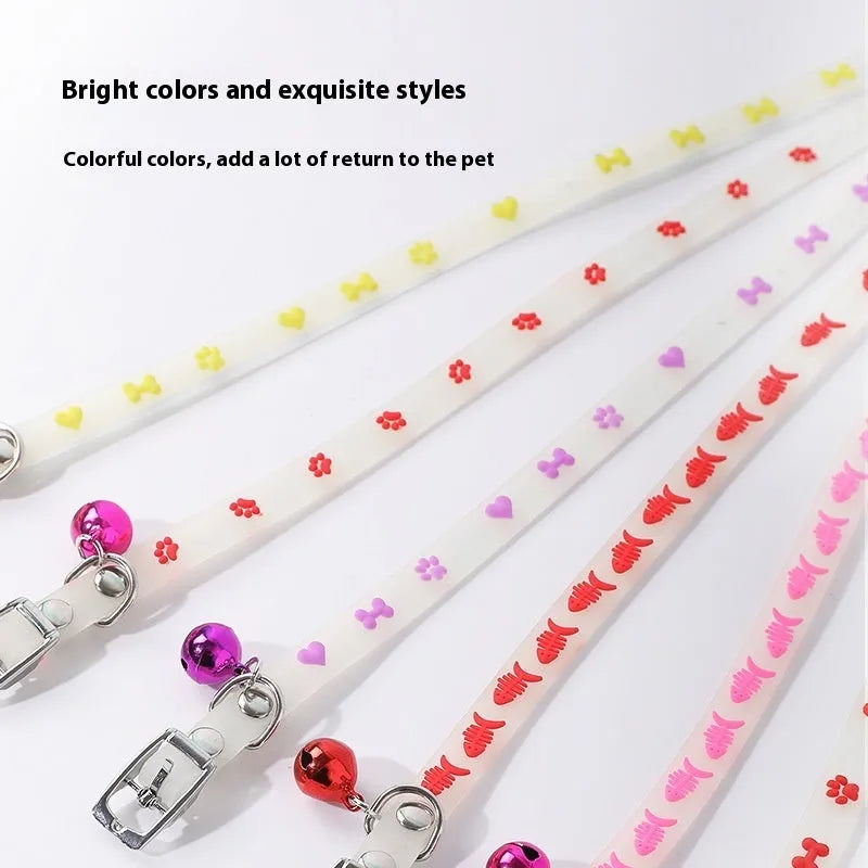 Adjustable cat luminous collar with silicone chain and metal bell showing nighttime illumination