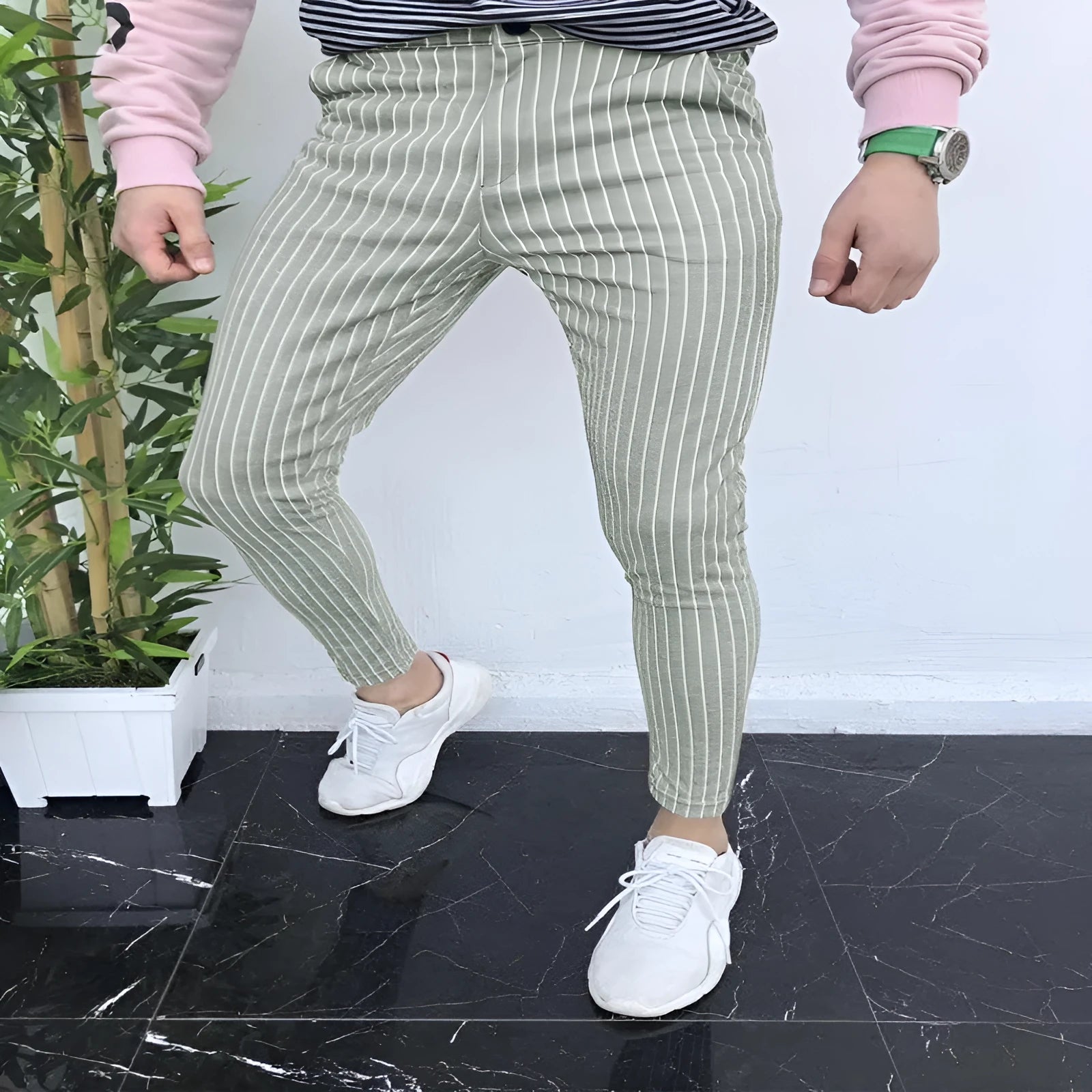 Man wearing slim-fit straight leg casual trousers with a 3D printed plaid pattern in a neutral colour.