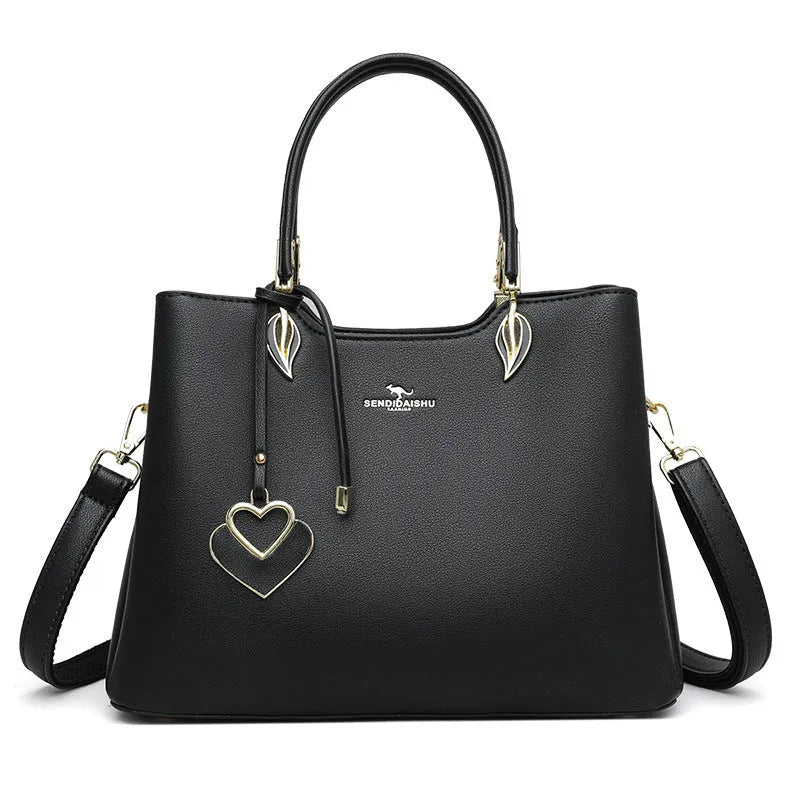 Women's black PU leather multi-compartment shoulder messenger bag with adjustable strap.