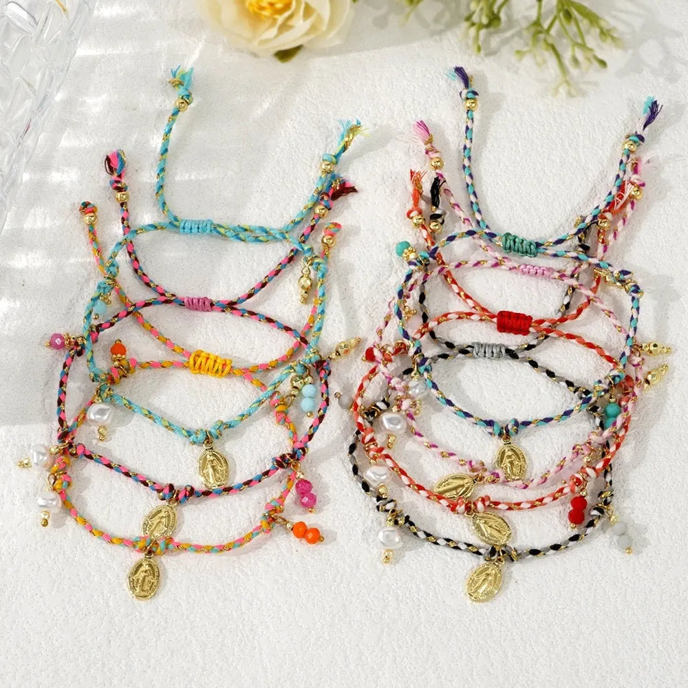 Close-up of a hand-woven colourful braided rope bracelet with an adjustable strap tag, showing ethnic style design.