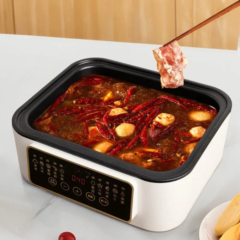 Stainless steel household electric steamer appliance with digital display and steaming rack.