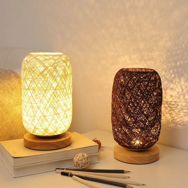 Brown hemp rope Sepak Takraw ball desk lamp with solid wood base on a desk.