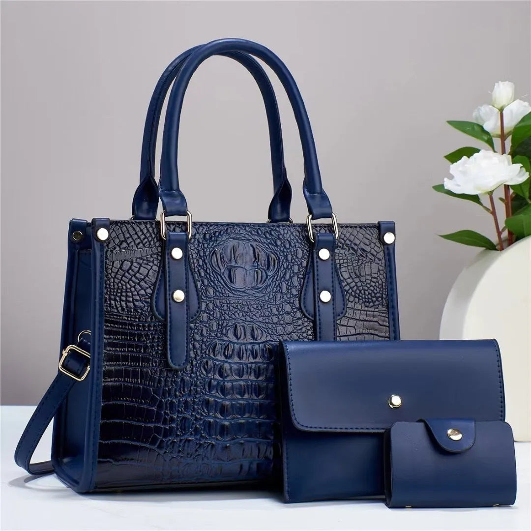 Women's textured PU leather three-piece travel bag set showing crossbody bag, wallet and card holder in coordinated colour