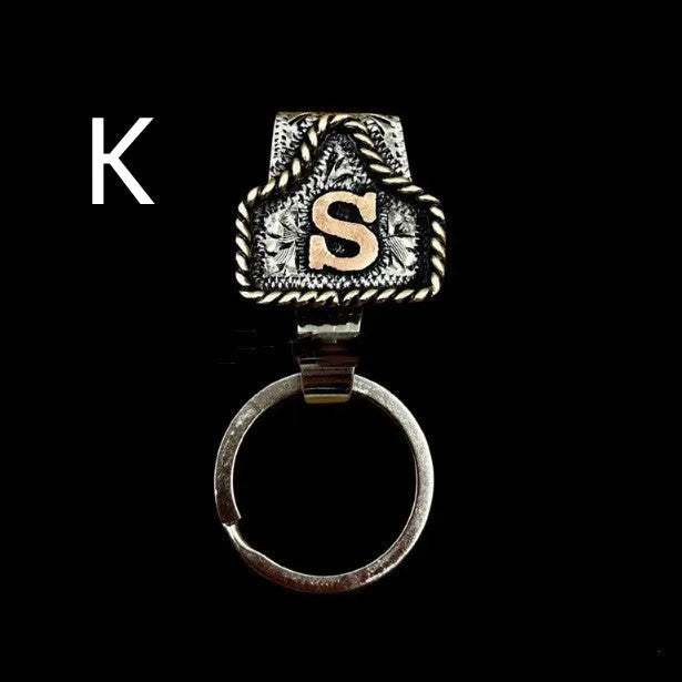 Handmade stainless steel cow tag belt key holder with engraved number plate on a split ring.