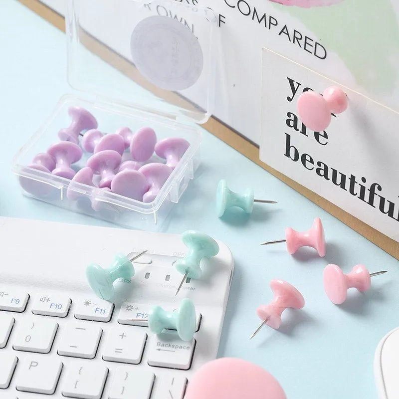 Plastic push pins in cherry blossom pink, mint green, and lavender, showing large and small sizes in a box.