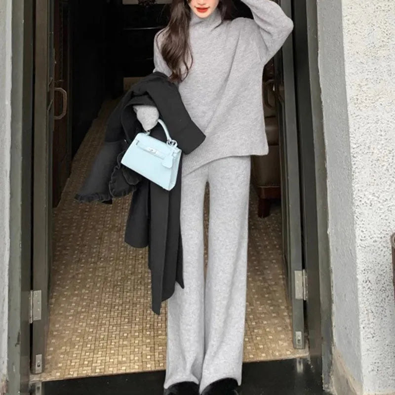 Women's beige acrylic long-sleeve sweater and wide-leg trousers two-piece casual set.