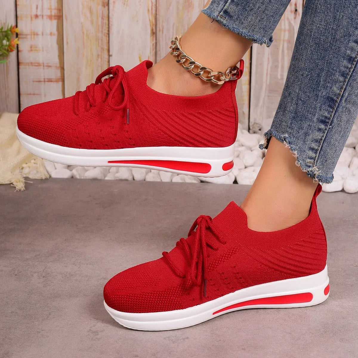 Women's low-top casual sneakers in red, black, or blue with round toe and front lace-up design.