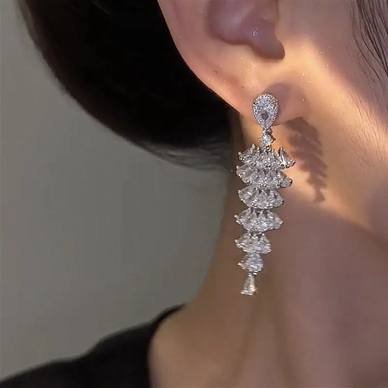 Christmas tree shaped drop earrings with sparkling zircon stones in silver pagoda colour