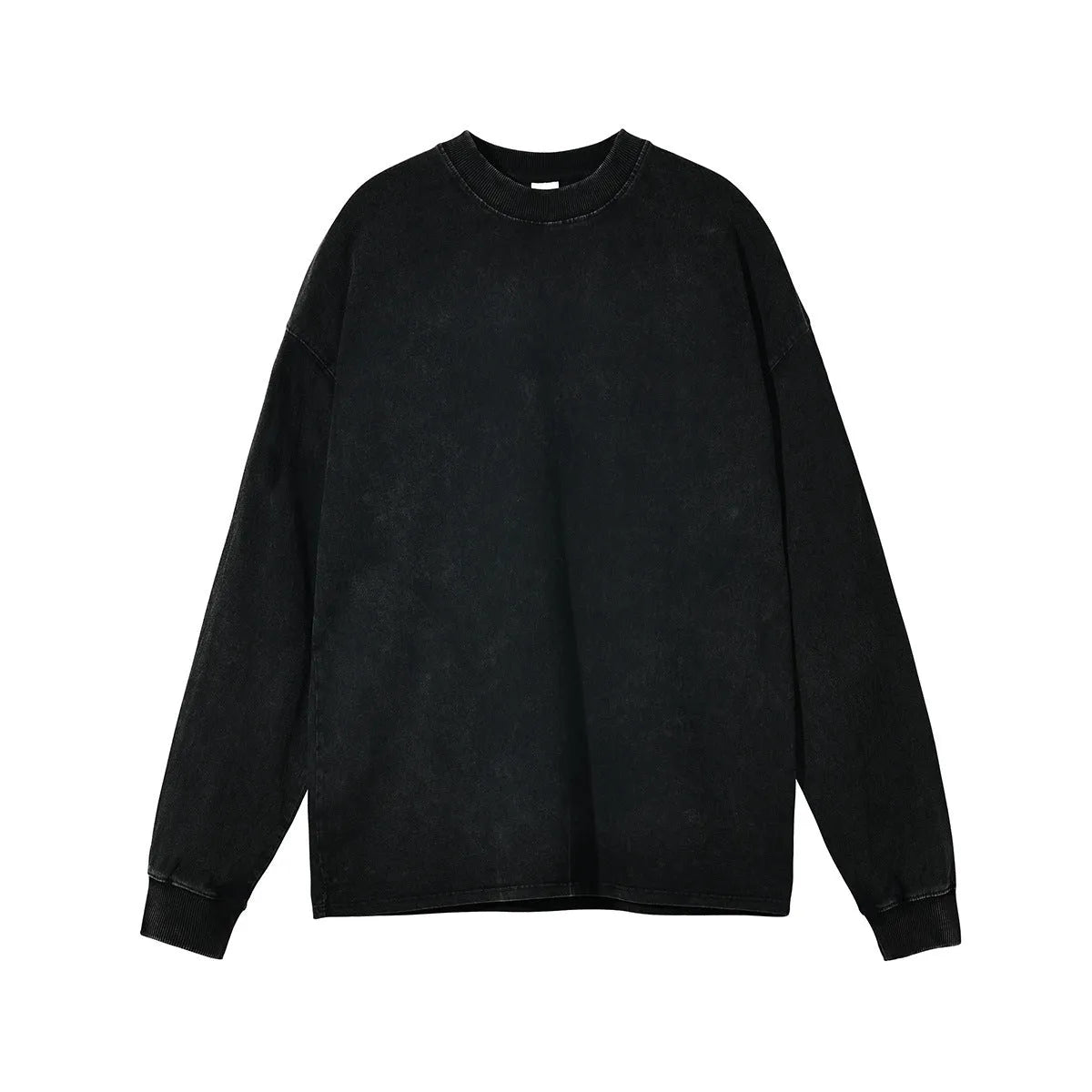 Man wearing a loose fit batik black washed vintage cotton long sleeve pullover.
