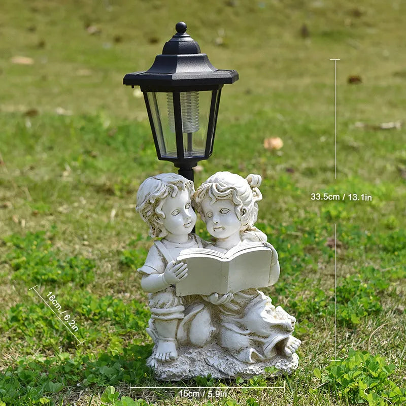 Solar hexagonal garden lamp with decorative resin figurine on plastic base for outdoor pathway lighting