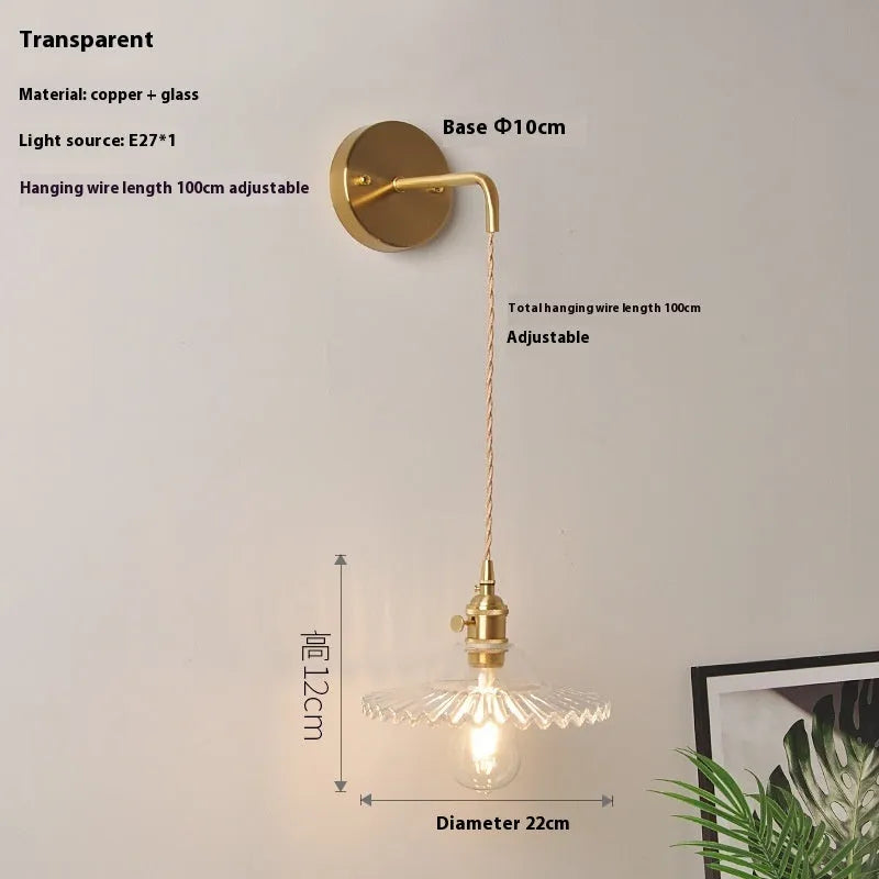 Retro brass lotus wall lamp with a glass shade in a choice of six colours.