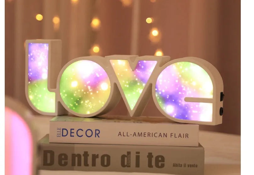 Colourful LED love light decorative lamp with plastic shell on a table
