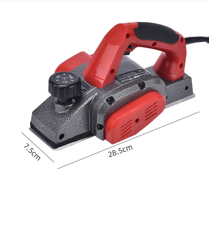 Red desktop electric wood planer with aluminium body showing 82mm cutting width