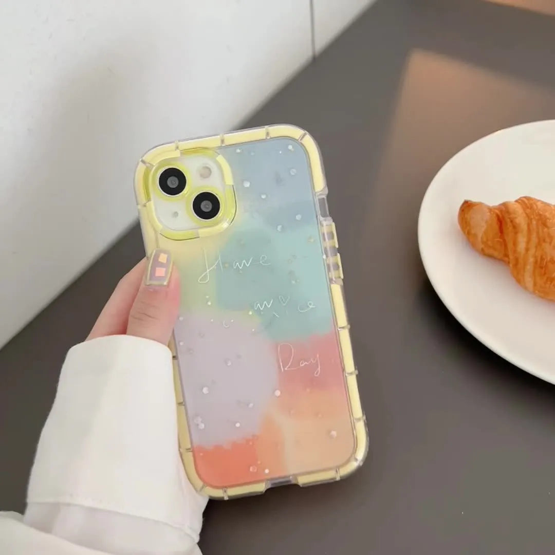Minimalist yellow-edged silicone phone case for iPhone 14 and other models on a table.