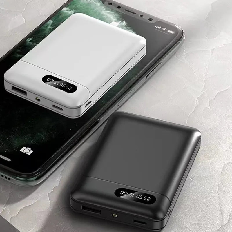 Black and white portable power bank showing dual USB ports and compact 92x63x23mm dimensions