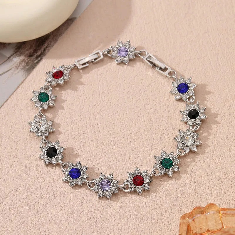 Floral zinc alloy bracelet with electroplated gold or silver finish and gemstone colour variants