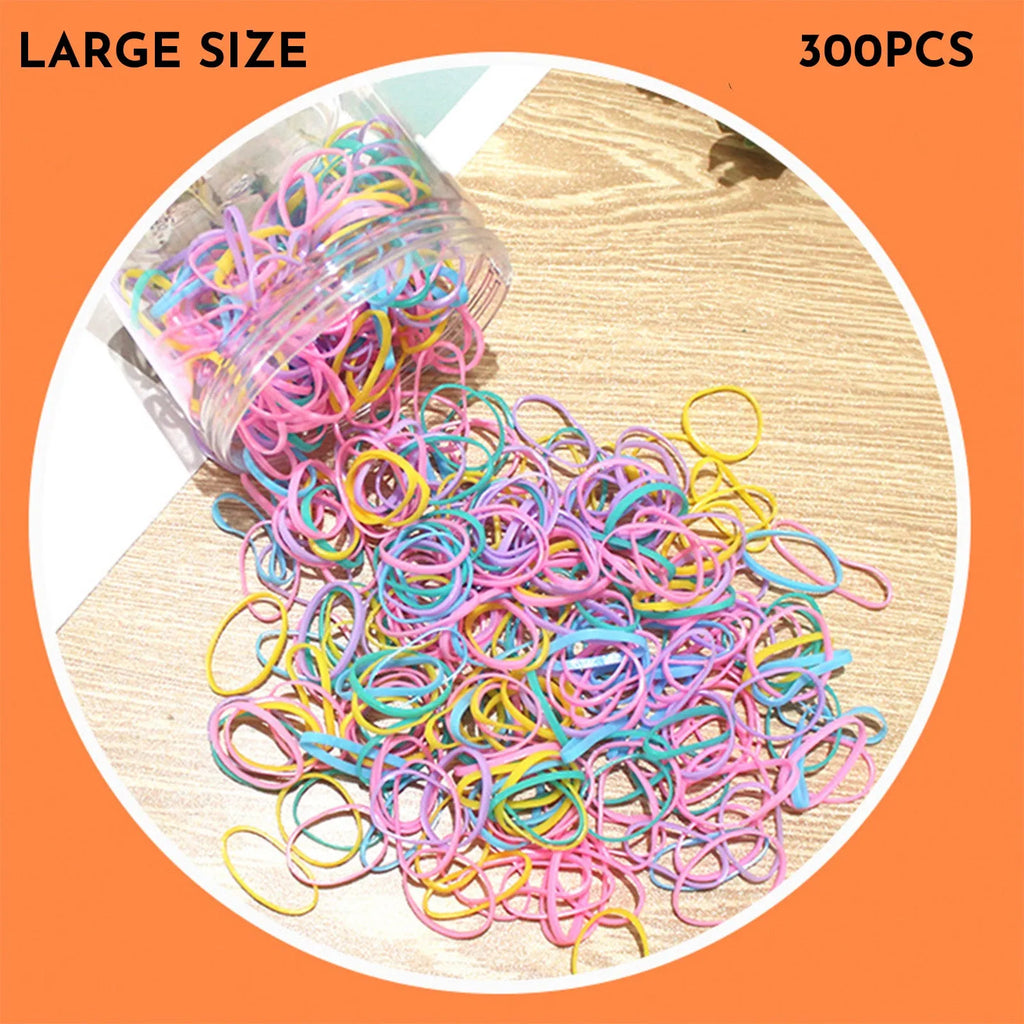 Multi-colour TPU baby hair ties for toddlers stored in a reusable clear container.