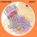Multi-colour TPU baby hair ties for toddlers stored in a reusable clear container.