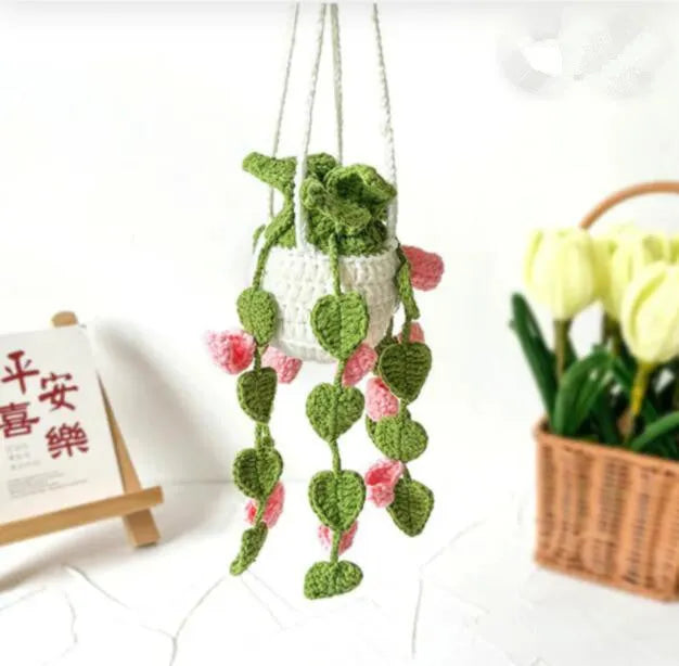 Green and white knitted rope car plant ornament with 8cm base and hanging rope.