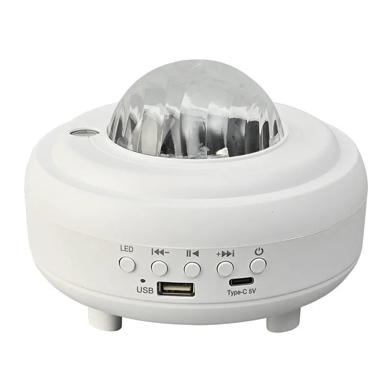 White Bluetooth galaxy star projector night lamp showing starry sky projection on a wall.
