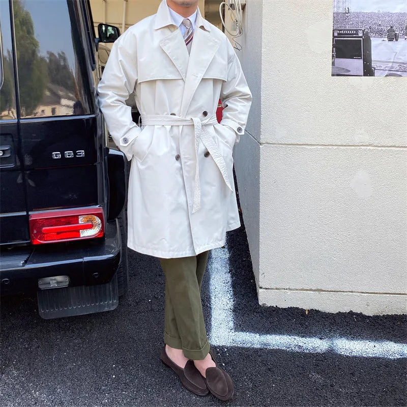 Mid-length trench coat with double-breasted lapels in black, washing finish, 65% cotton 35% polyester