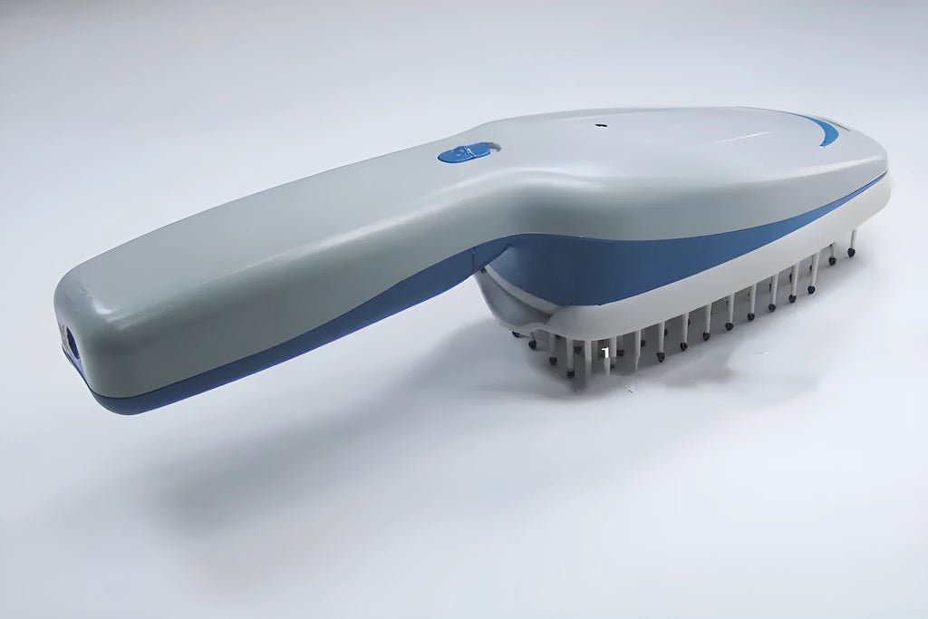 Pet comb with negative ion technology, removable brush head, and 9V battery compartment.