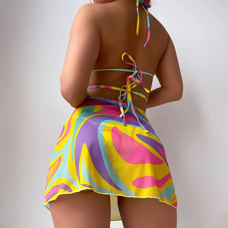 Yellow striped halter-neck swimsuit set for women with lace-up front, includes skirt and shorts