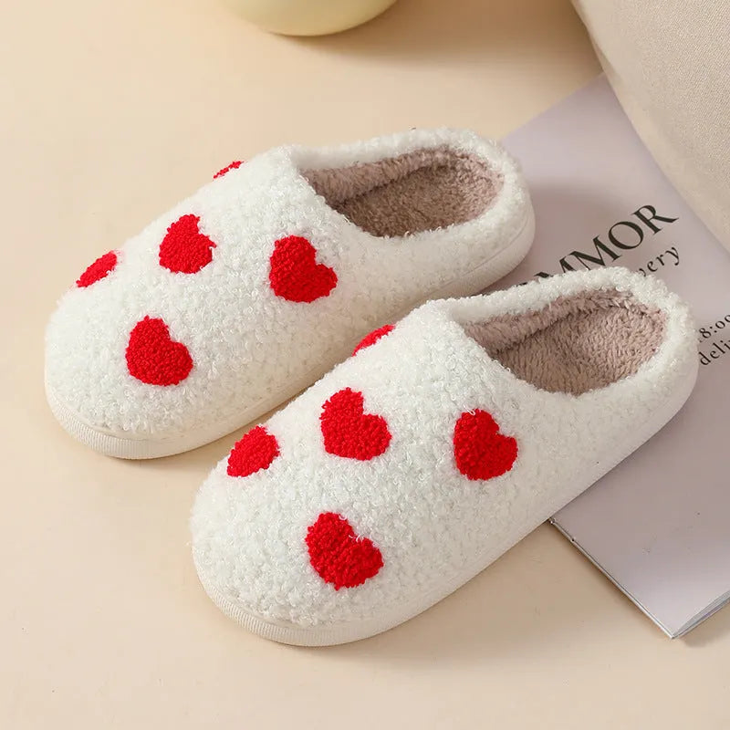 Plush women's slippers in Big Love colour with non-slip PVC sole and round toe.