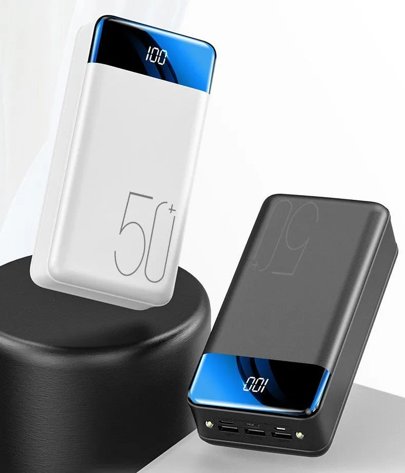 Large 50000mAh capacity power bank with three output ports in black or white plastic casing