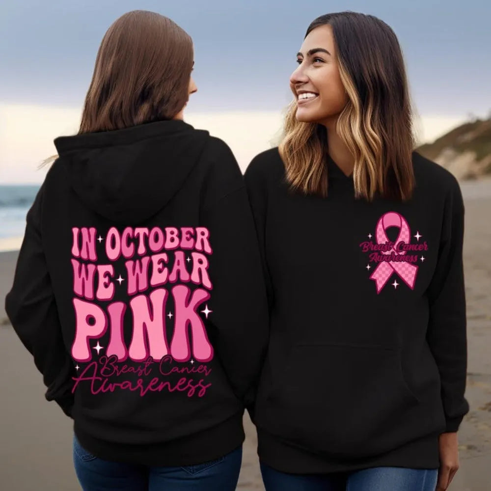 Pink breast cancer awareness pullover hoodie with retro art print and side seam pockets.