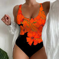 Women's one-piece swimsuit with a 3D printed pattern in orange red, made from polyester and spandex.