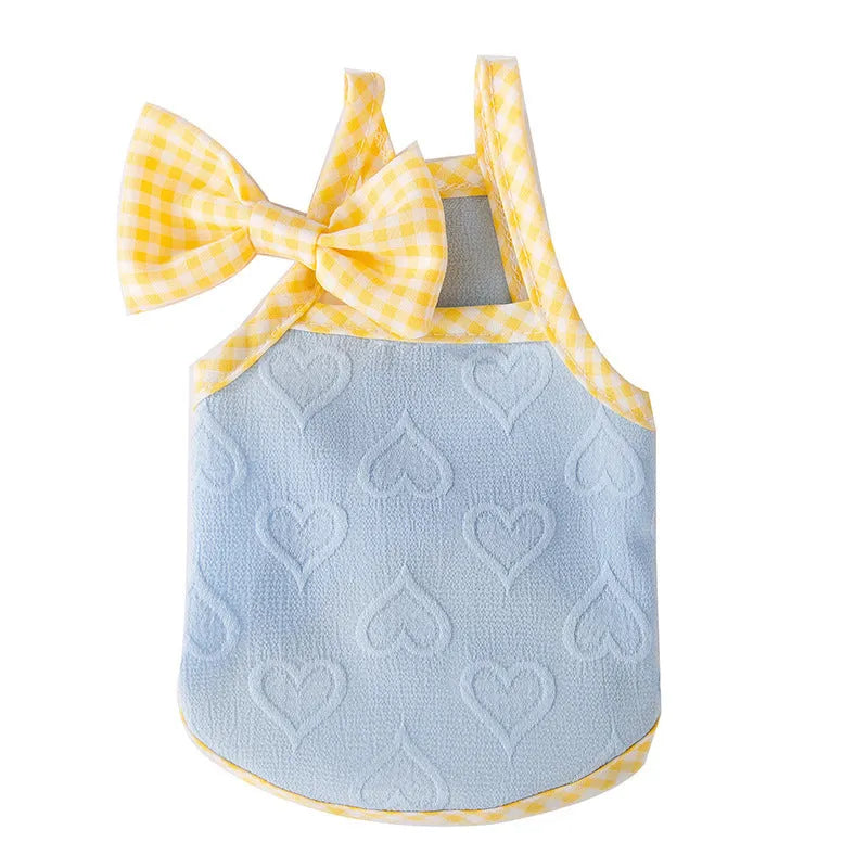 Small dog wearing heart texture vest with bow suspenders in Bondi Blue colour