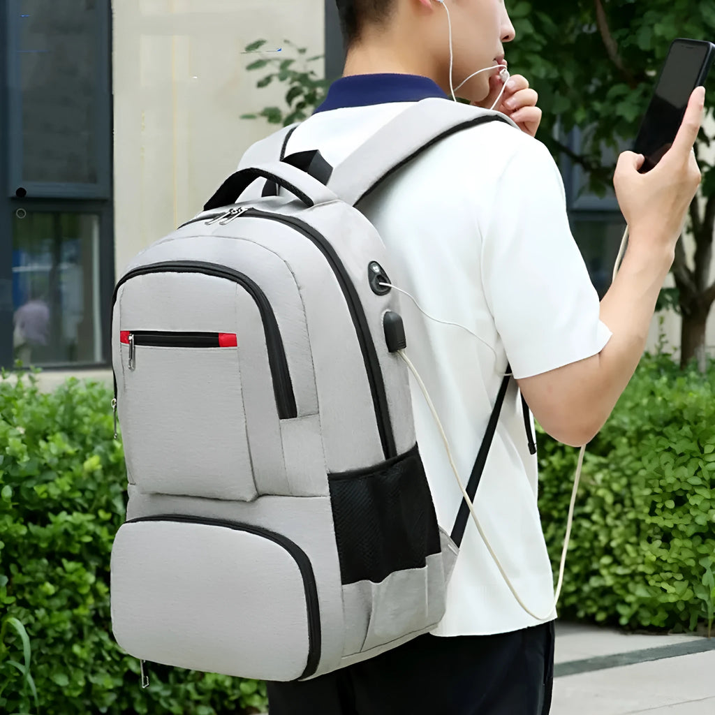 Light grey Oxford cloth insulated picnic backpack with curved shoulder straps and multiple compartments.
