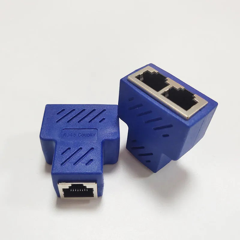 Two white RJ45 network cable splitters showing three female Ethernet ports each.