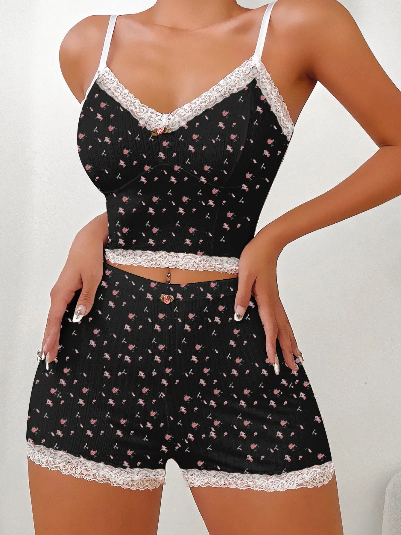 Design Sense ladies home leisure suit two-piece set with sleeveless top and shorts in white background floral pattern