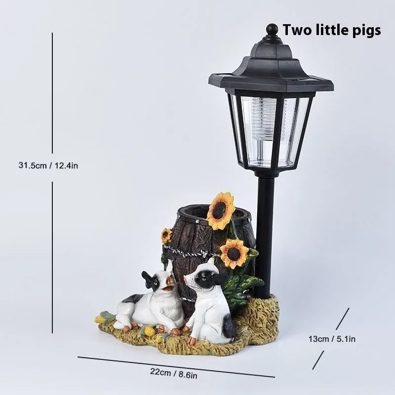 Solar hexagonal garden lamp with decorative resin figurine on plastic base for outdoor pathway lighting