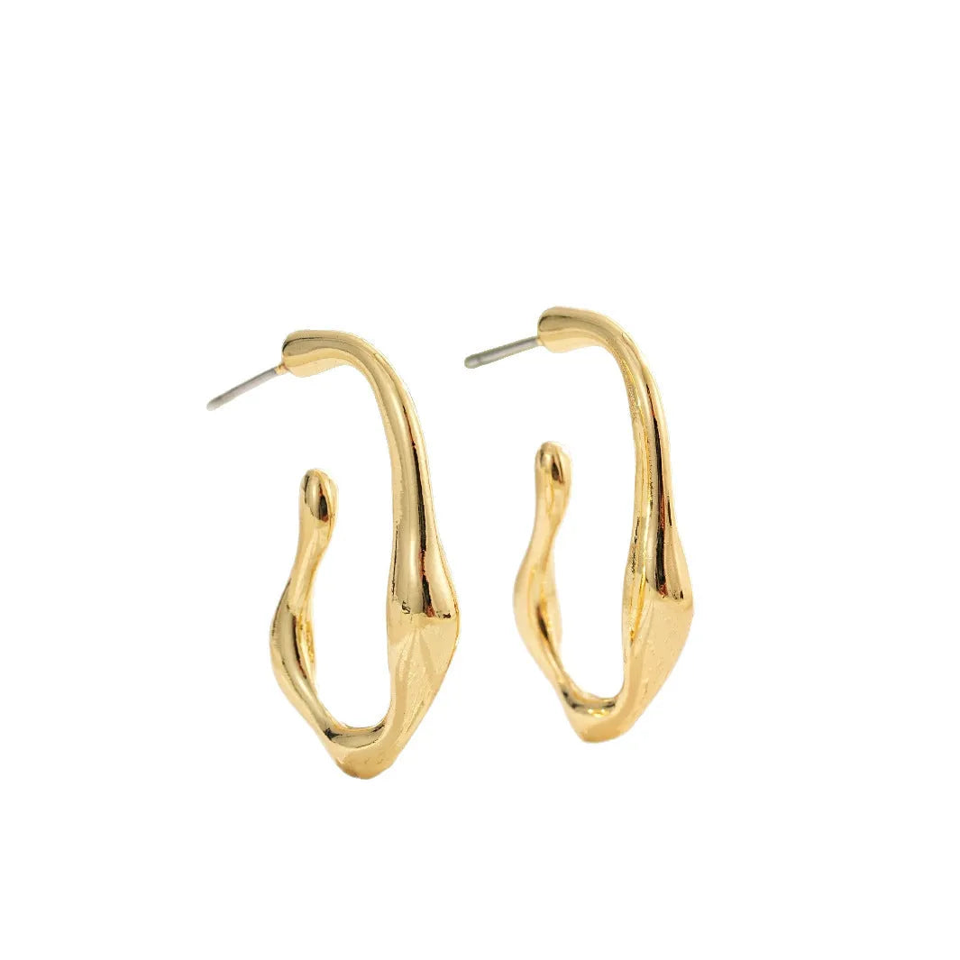 Irregular shaped minimalist gold dangle earrings for women on white background