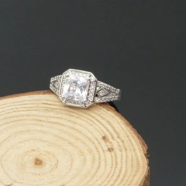 Platinum finish geometric zircon ring with hollow design and quadrilateral patterning