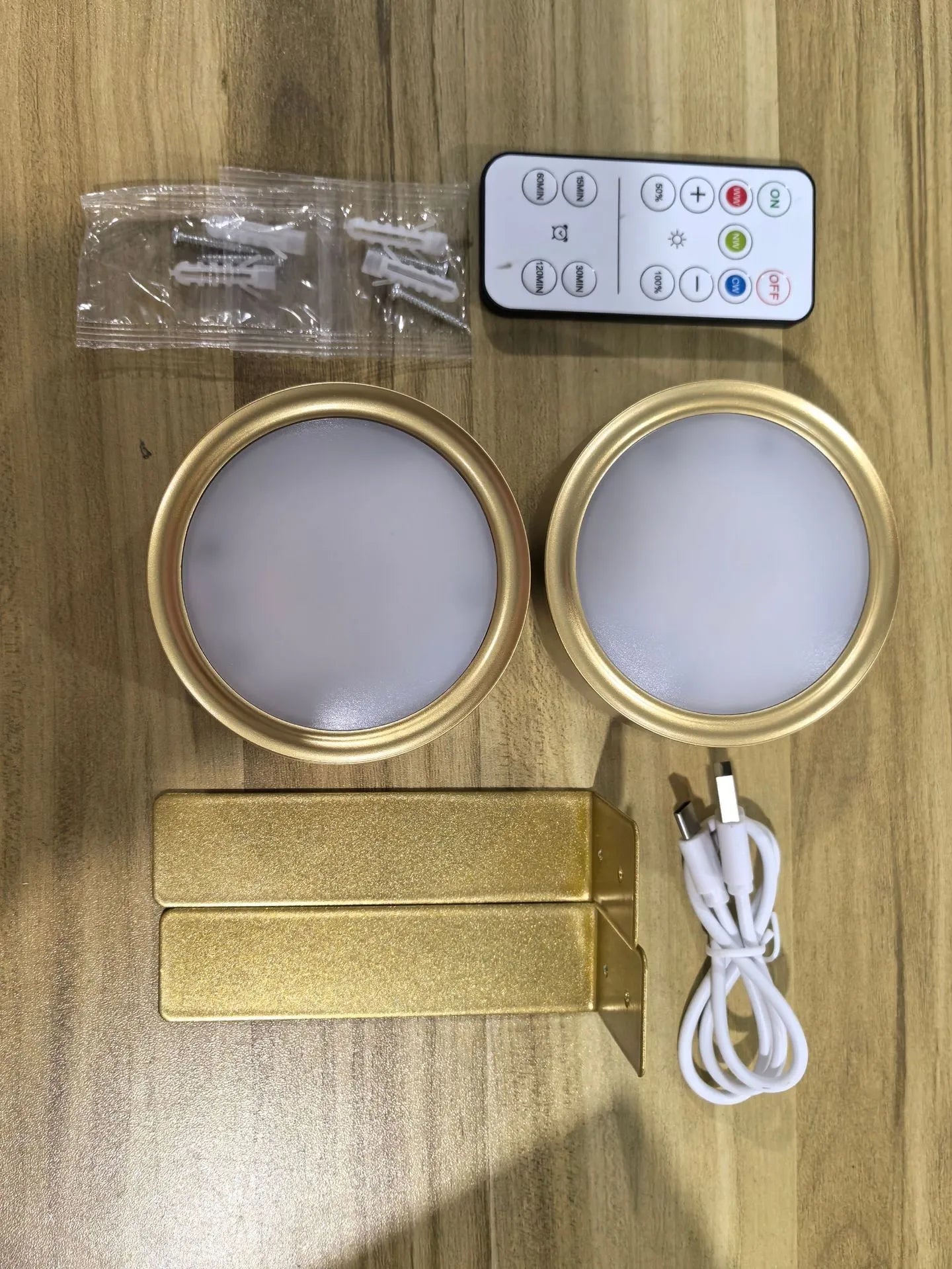 Wireless rechargeable LED painting lamp with magnetic belt attached to a metal frame, remote control nearby.