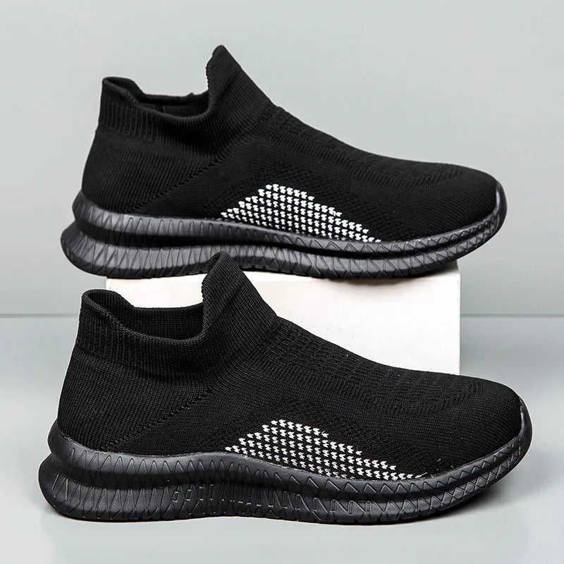 Men's white Popcorn Flyknit low-top casual sneakers with round toe on a neutral background.