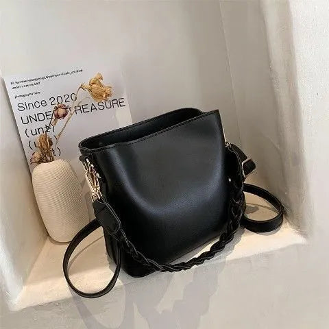 Retro khaki woven PU leather one-shoulder crossbody underarm bucket bag.